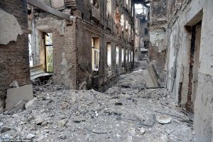 54759769-10561485-This_photograph_shows_a_view_of_a_school_destroyed_as_a_result_o-a-20_1646105216583